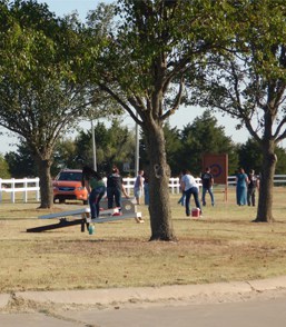 VMI friends and family playing cornhole