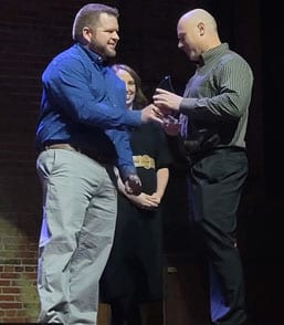 Cash Maitlen with commemorative plaque